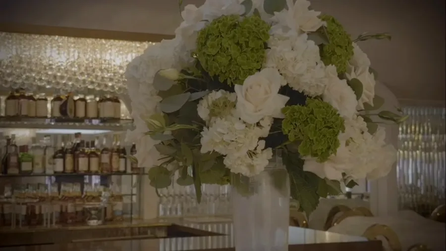 Floral arrangement in front of the bar