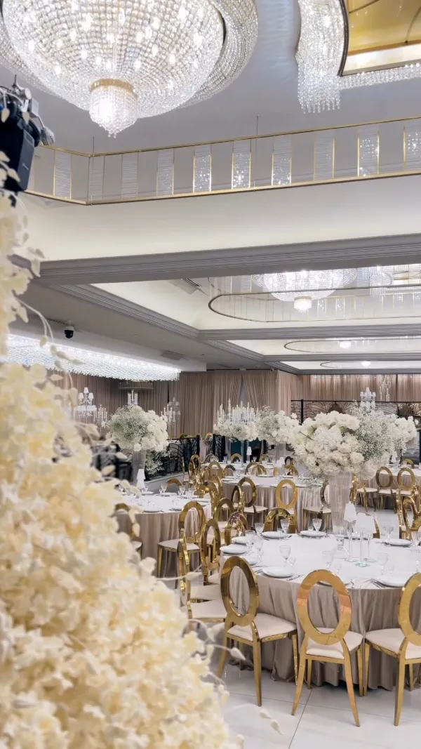 Crystal chandeliers and gold chairs across the Arbat Banquet Hall ballroom