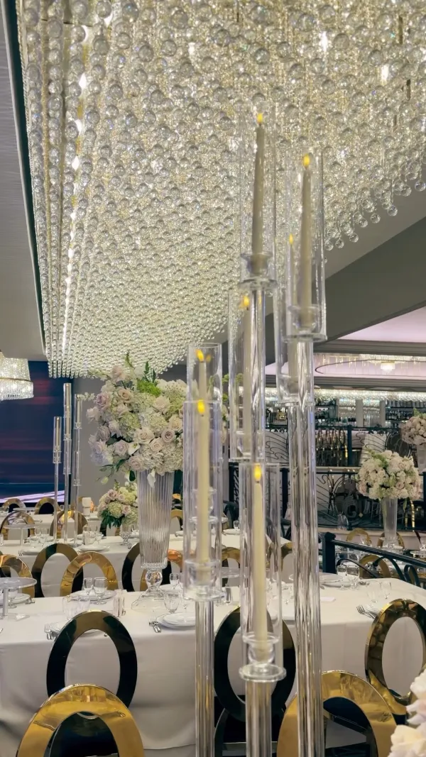 Long head table with crystal candelabras and white florals