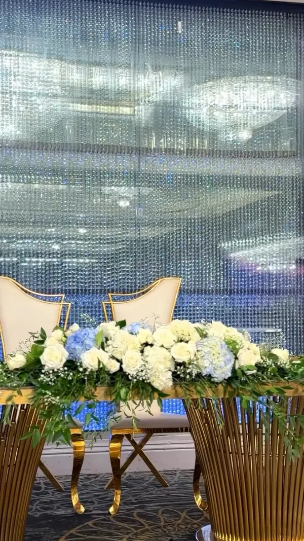 Sweetheart table in soft blue and white